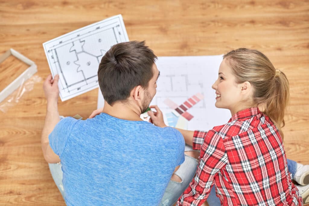 Homeowners reviewing remodeling plans and finish samples