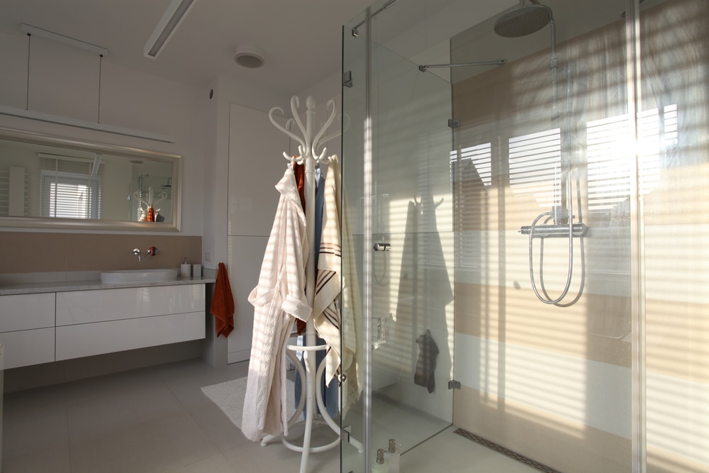 Bright walk-in shower with glass walls for an accessible bathroom remodel