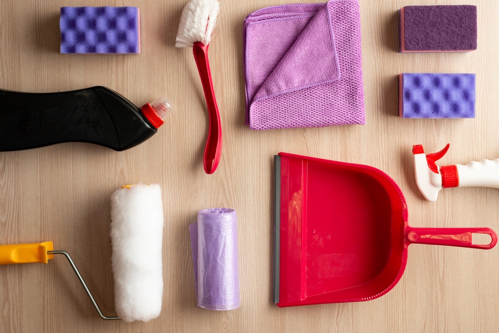 Household accessories neatly laid out on the table. Top view
