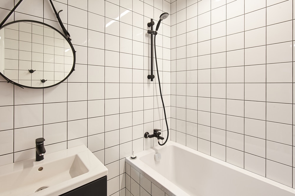 Accessible bathroom shower wall with practical fixture layout