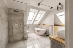 Bathroom with shower, tub, sink, and bright roof windows