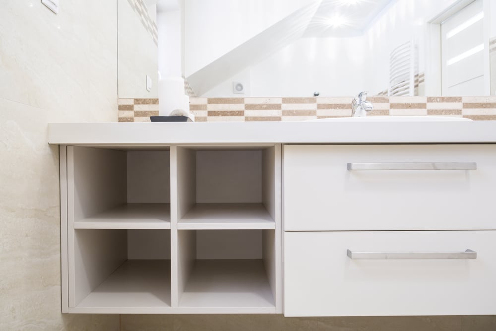 View of empty case in bright bathroom