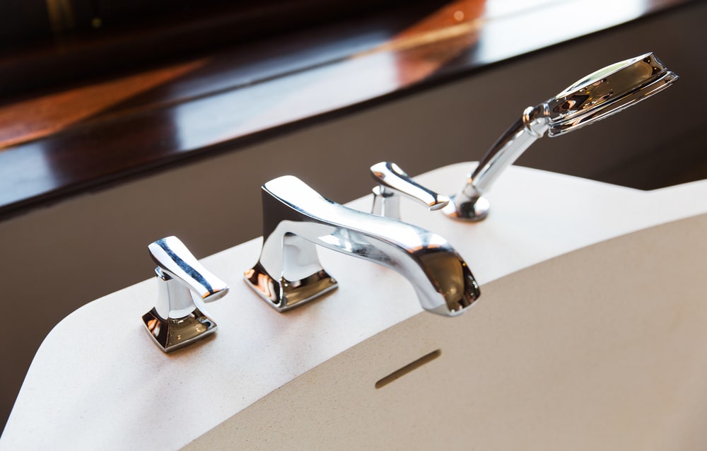 Bath tap and shower fixture close-up for replacement budgeting