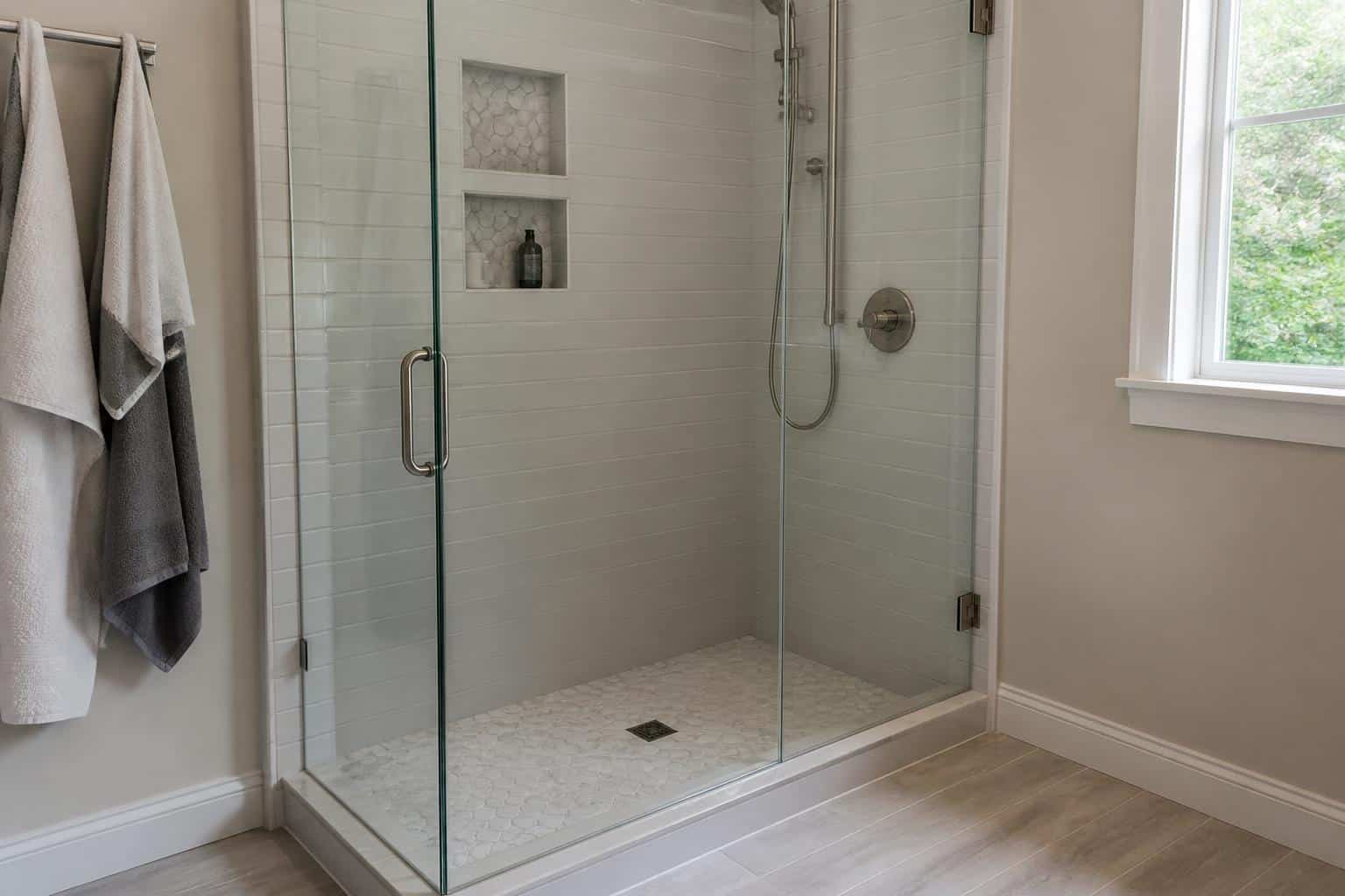 Curbless tile shower with linear drain and flush floor transition